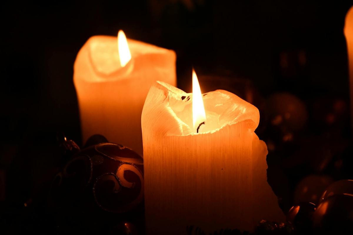 Image of two candles with flickering flames